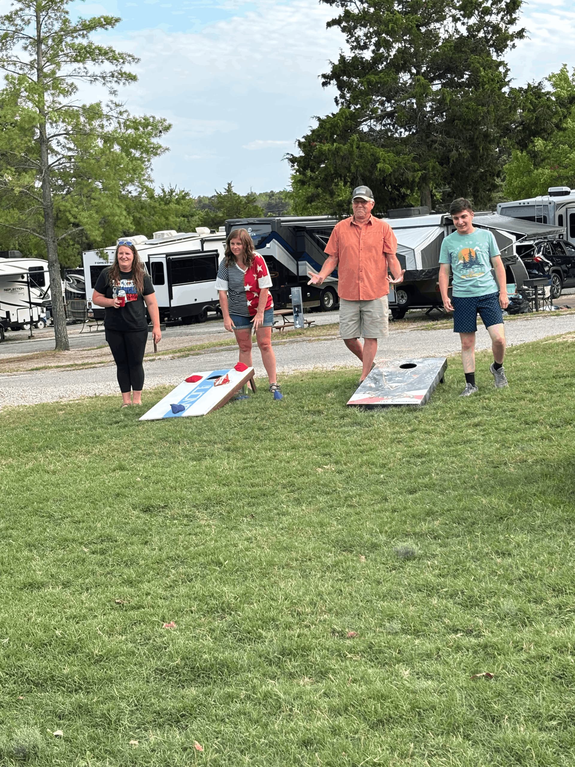 A group of people are playing a game of frisbee in a grassy field